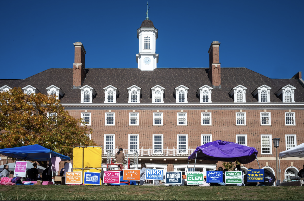 Candidate signs in front of the Illini Union on Oct. 24 encouraging eligible students to vote.
